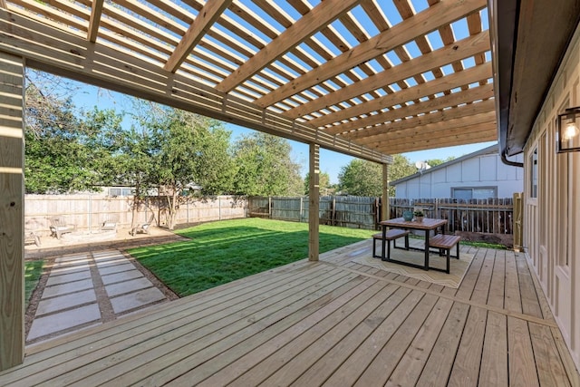 wooden terrace featuring a lawn