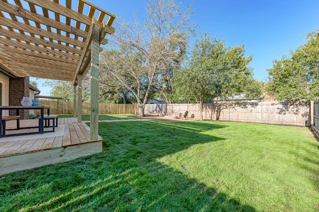 view of yard with a pergola and a deck