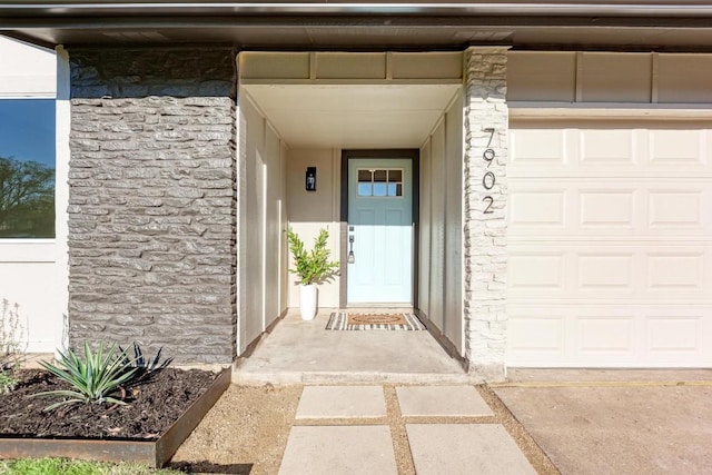 property entrance with a garage