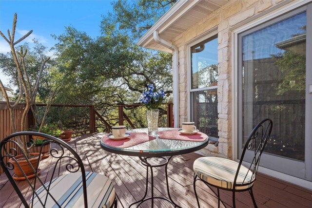 wooden balcony featuring a deck