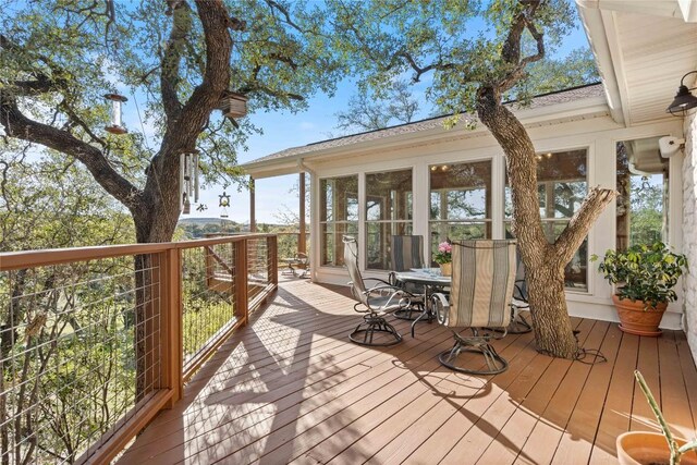 wooden terrace with a sunroom