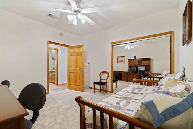 bedroom featuring ceiling fan, a closet, and light colored carpet