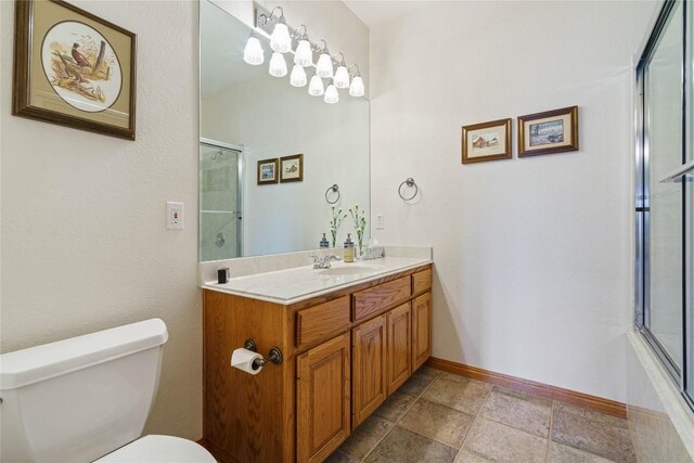 bathroom featuring toilet and vanity