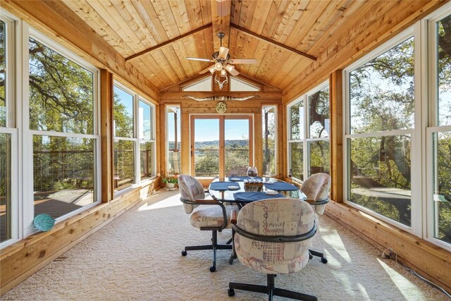 sunroom / solarium with ceiling fan, wooden ceiling, and vaulted ceiling