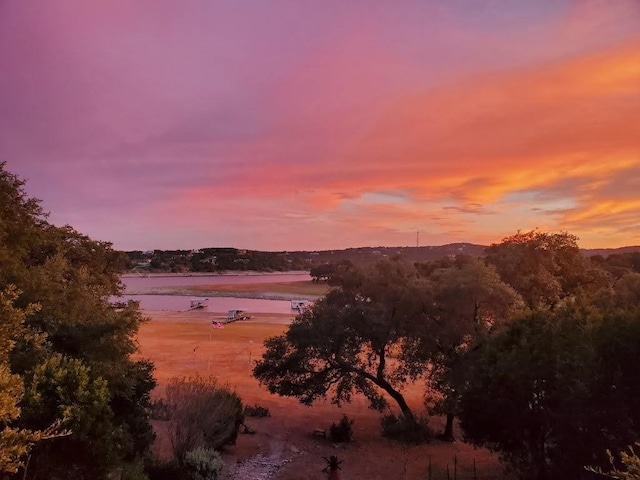 nature at dusk featuring a water view