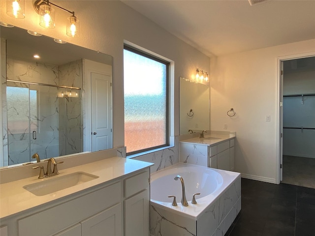 bathroom with tile patterned flooring, plus walk in shower, a healthy amount of sunlight, and vanity