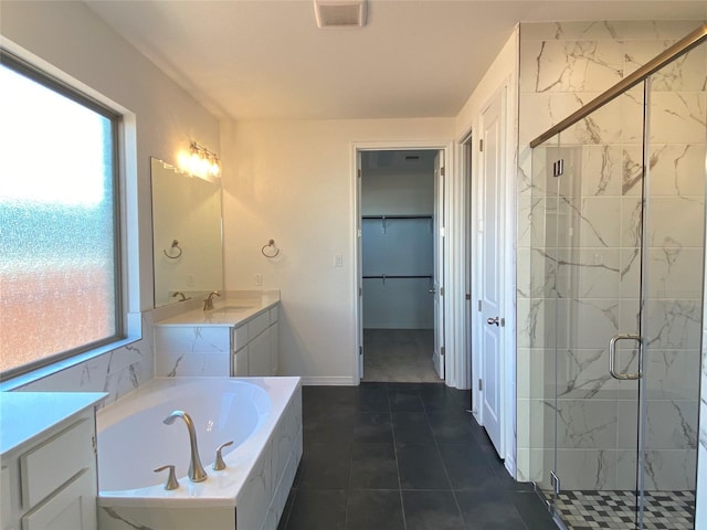 bathroom with vanity, shower with separate bathtub, and tile patterned flooring