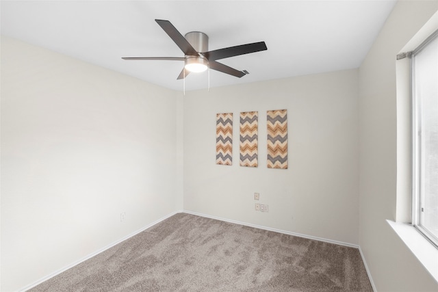 carpeted empty room with ceiling fan