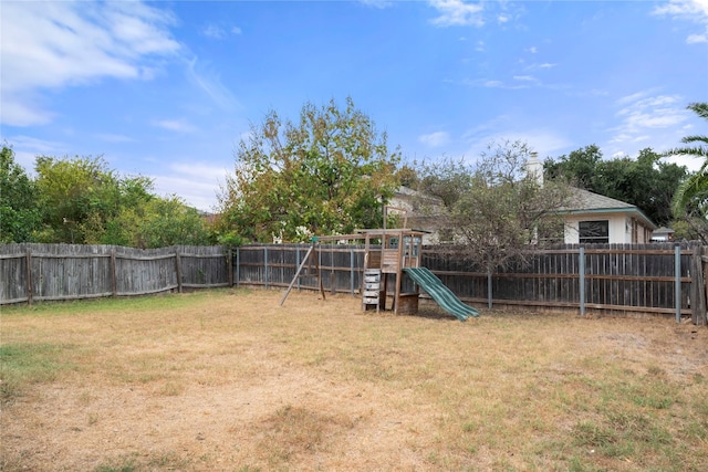 view of yard with a playground