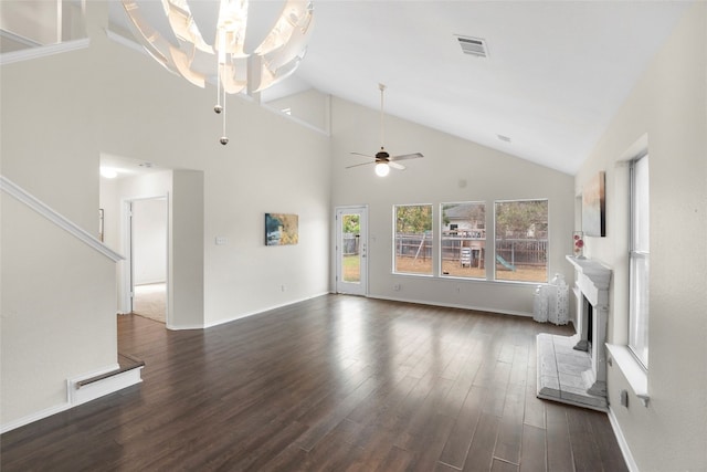 unfurnished living room with dark hardwood / wood-style floors, high vaulted ceiling, and ceiling fan