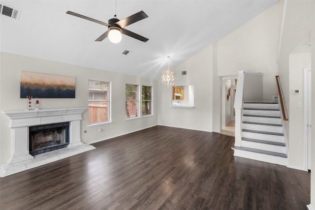 unfurnished living room with high vaulted ceiling, wood-type flooring, and ceiling fan with notable chandelier