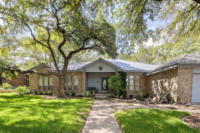 300 Delaware Springs Blvd, Burnet, TX 78611 - single story home featuring a front lawn, brick siding, covered porch, and a standing seam roof