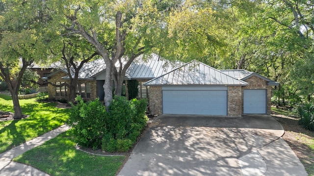 view of front facade with a front yard and a garage