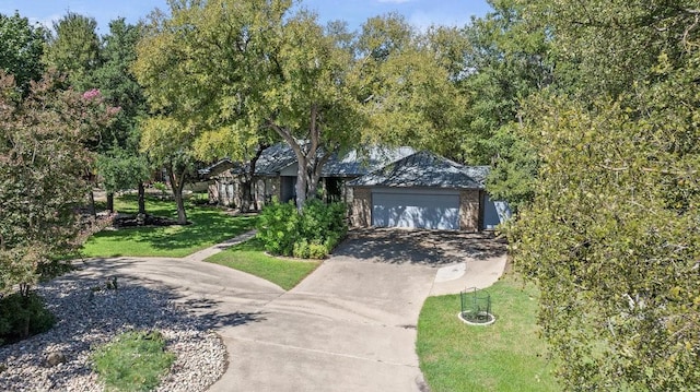 300 Delaware Springs Blvd, Burnet, TX 78611 - view of front of house with driveway, a front lawn, and a garage