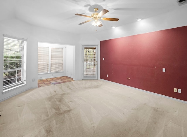 carpeted empty room with ceiling fan