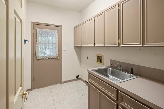 laundry room featuring hookup for a washing machine, light tile patterned floors, cabinets, and sink