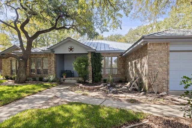 300 Delaware Springs Blvd, Burnet, TX 78611 - ranch-style home with a standing seam roof, a metal roof, brick siding, and a garage
