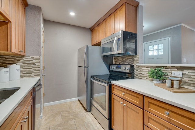 kitchen featuring ornamental molding, stainless steel appliances, and tasteful backsplash