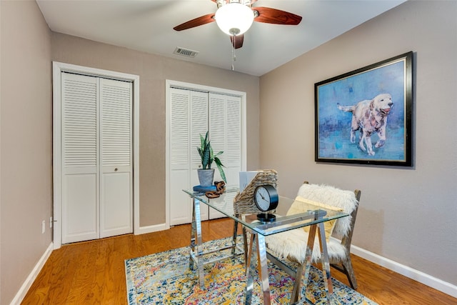 office area with hardwood / wood-style flooring and ceiling fan