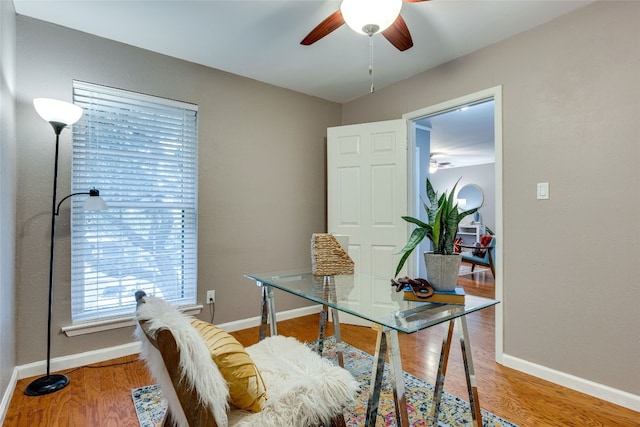 office area with hardwood / wood-style flooring and ceiling fan