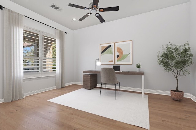 office area with hardwood / wood-style floors and ceiling fan