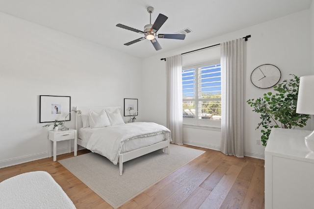 bedroom with light wood-type flooring and ceiling fan