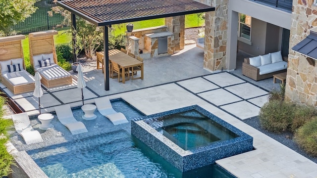 view of pool with an in ground hot tub, an outdoor living space, exterior kitchen, and a patio area