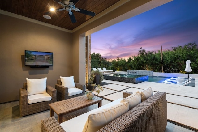 view of patio / terrace with an outdoor living space and ceiling fan