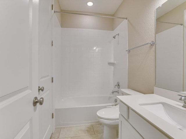 full bathroom with vanity, toilet, tiled shower / bath combo, and tile patterned flooring