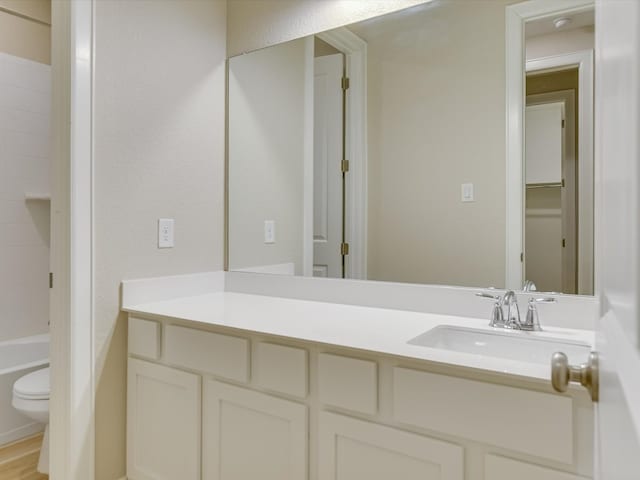 full bathroom featuring vanity, toilet, and independent shower and bath