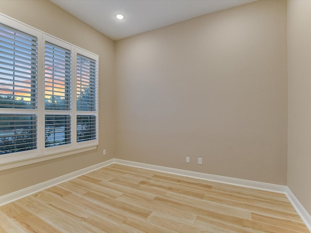 spare room with light wood-type flooring