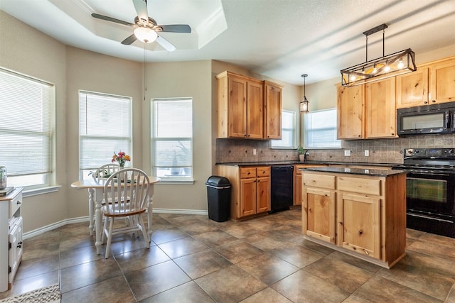 kitchen with a raised ceiling, ceiling fan, backsplash, black appliances, and pendant lighting