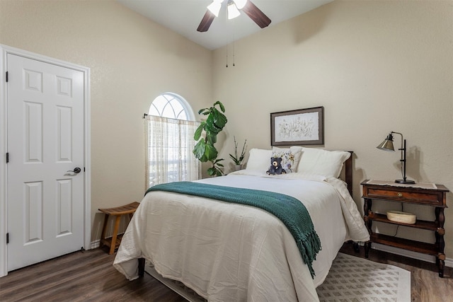 bedroom featuring lofted ceiling, ceiling fan, and dark hardwood / wood-style flooring