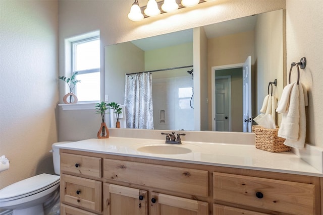 bathroom with vanity, toilet, and a shower with shower curtain