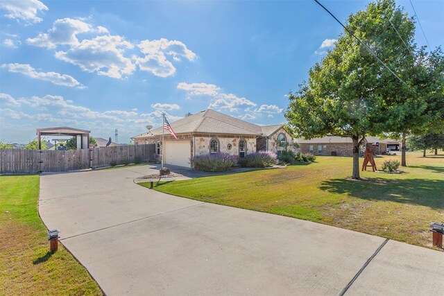 ranch-style home with a garage and a front lawn