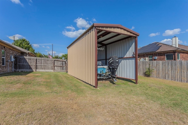 view of outdoor structure featuring a lawn