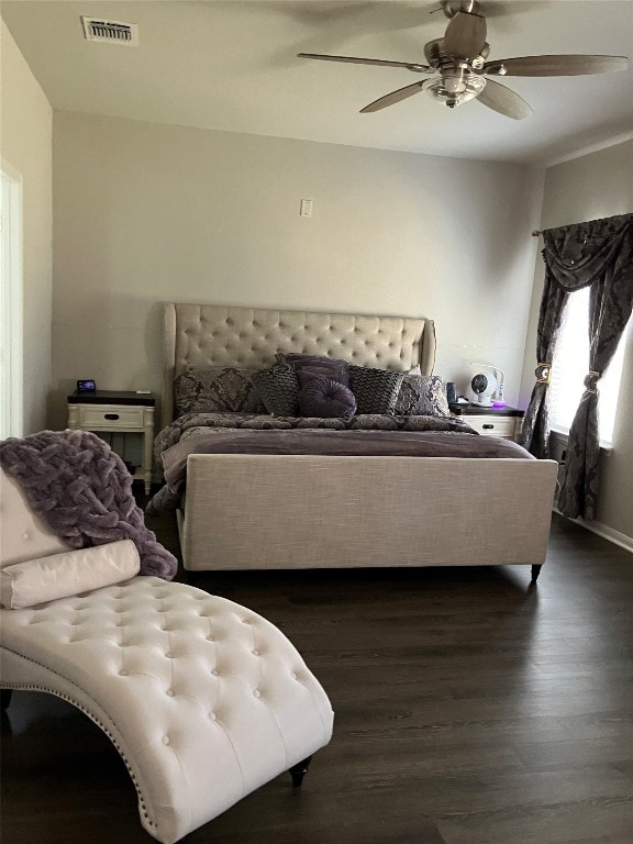 bedroom with dark wood-type flooring and ceiling fan