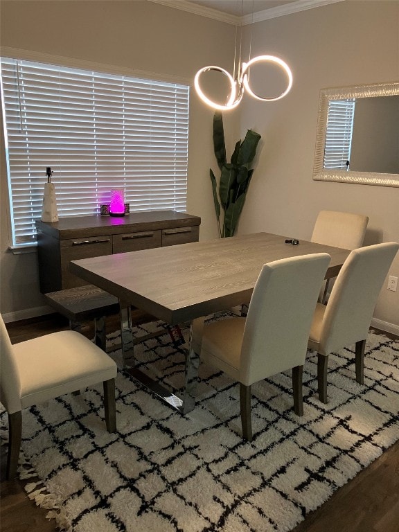 dining space with crown molding and dark hardwood / wood-style flooring