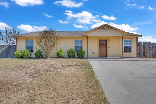 ranch-style house with a front lawn