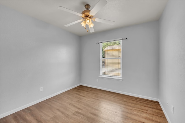 empty room featuring light hardwood / wood-style floors and ceiling fan