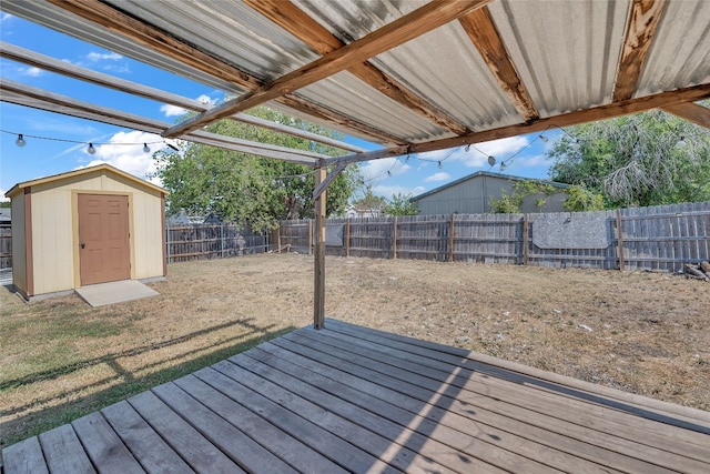 wooden terrace featuring a storage unit