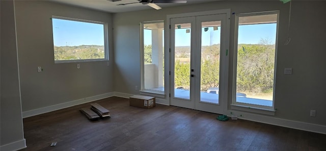 entryway with dark wood-type flooring, french doors, baseboards, and a ceiling fan