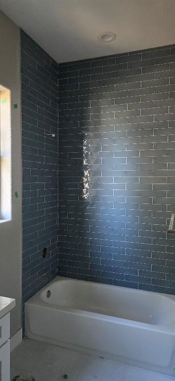 bathroom featuring shower / bathtub combination, vanity, and tile patterned floors