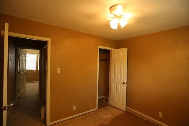 unfurnished bedroom featuring a closet and a textured ceiling