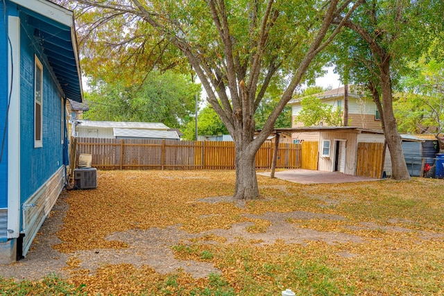 view of yard featuring a patio area and central AC