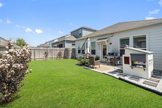 back of property featuring a patio area and a lawn