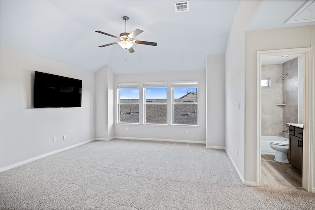 unfurnished living room with lofted ceiling, light carpet, and ceiling fan