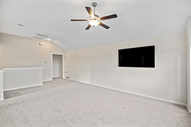 carpeted empty room with lofted ceiling and ceiling fan