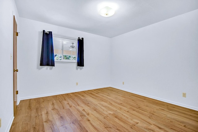 spare room with light hardwood / wood-style floors