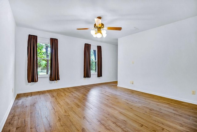 298 Jenkins Rd, Cedar Creek, TX 78612 - unfurnished room with light wood-style floors, ceiling fan, and baseboards
